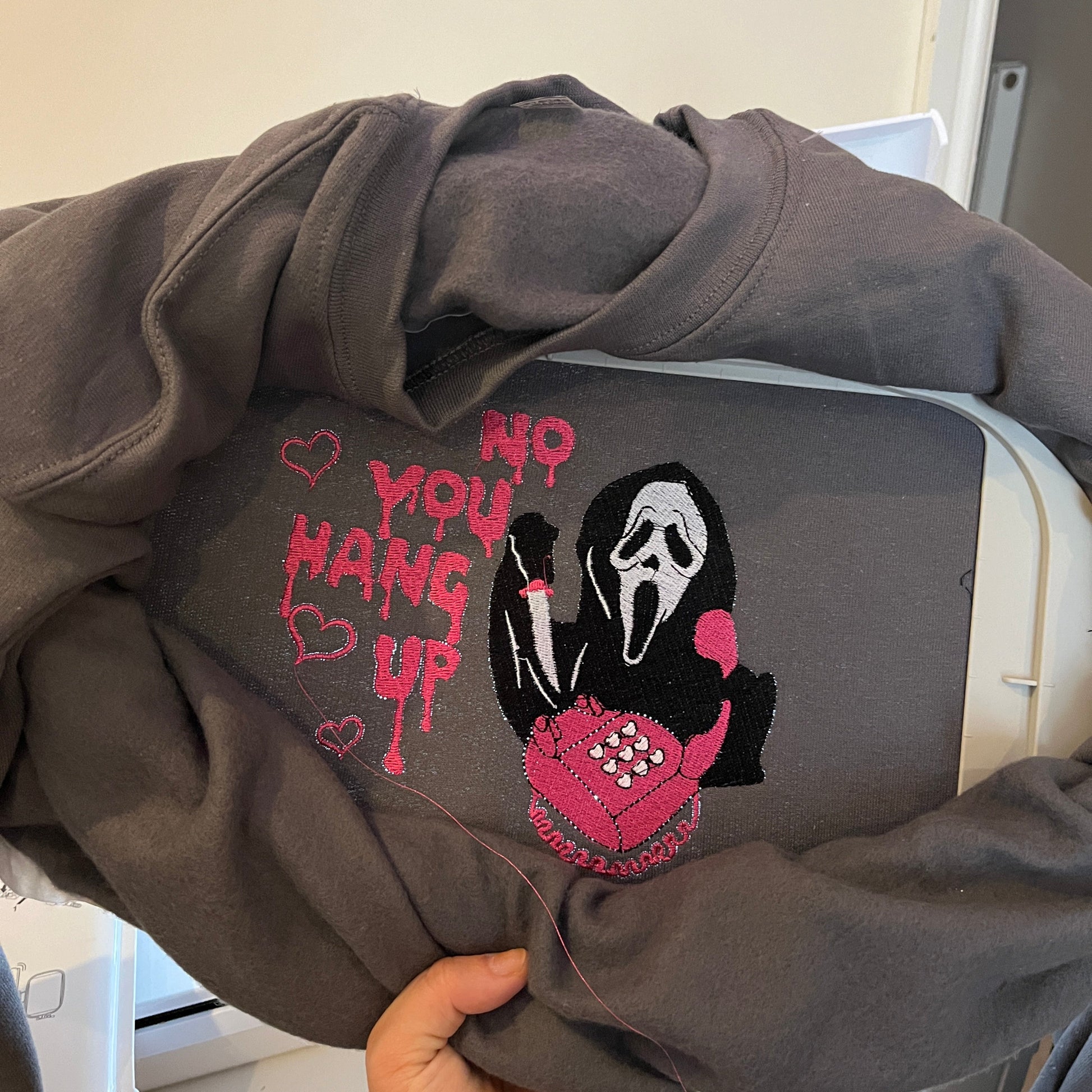 Dark hoodie with a halloween embroidered design