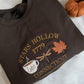 Dark brown sweatshirt with embroidered design