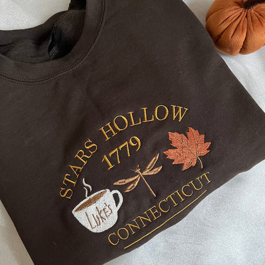 Dark brown sweatshirt with embroidered design